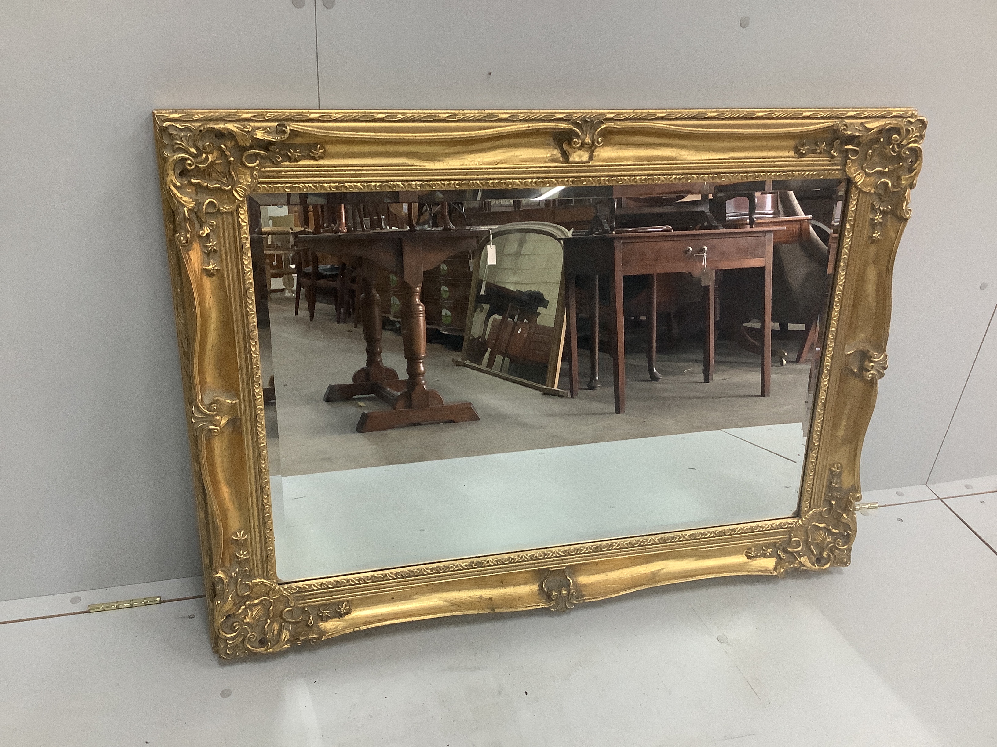 A Victorian style rectangular gilt composition wall mirror, width 109cm, height 79cm